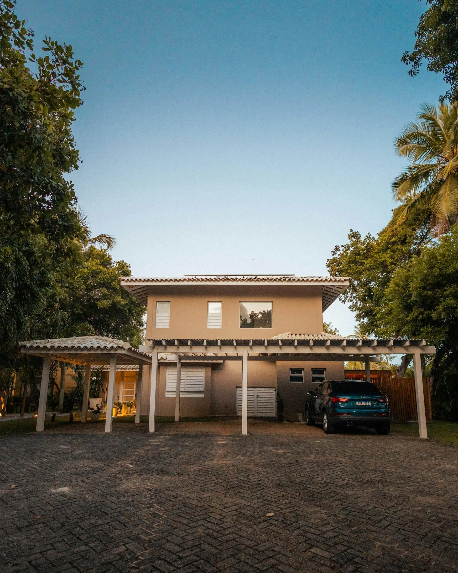 Large two-storey bungalow with a balcony, double-height porch and wide driveway