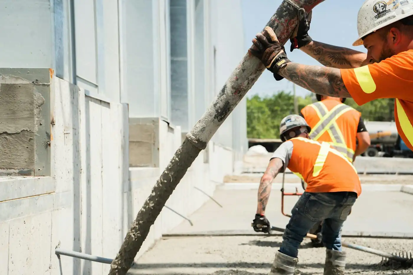 Concrete being poured into a reinforced raft foundation at a house site