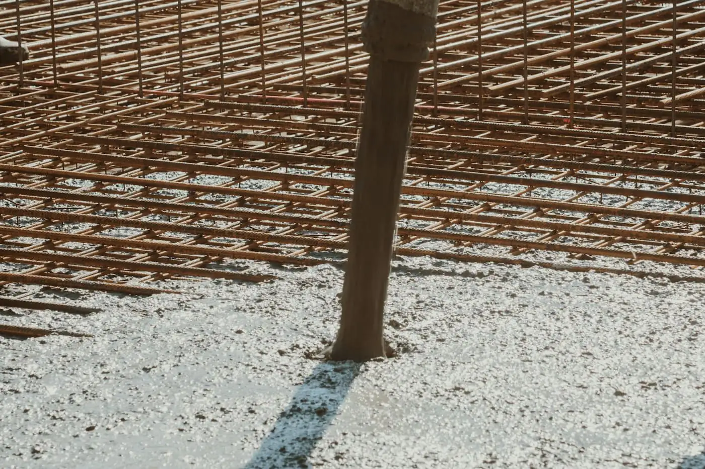 Timber formwork and steel bars for ground beams at a single-storey house site